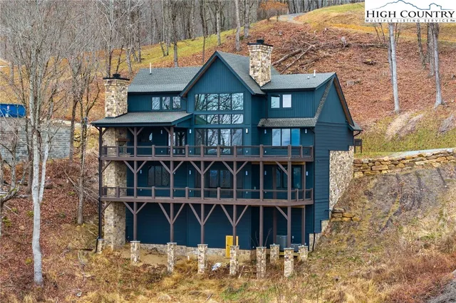 a front view of a house with wooden stairs