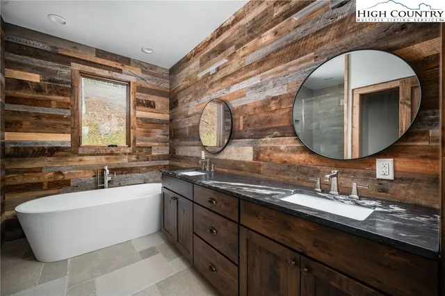 a bathroom with a bathtub and a sink