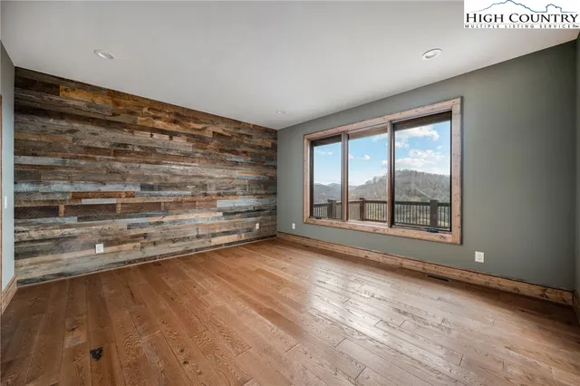 a view of room with closet and wooden floor