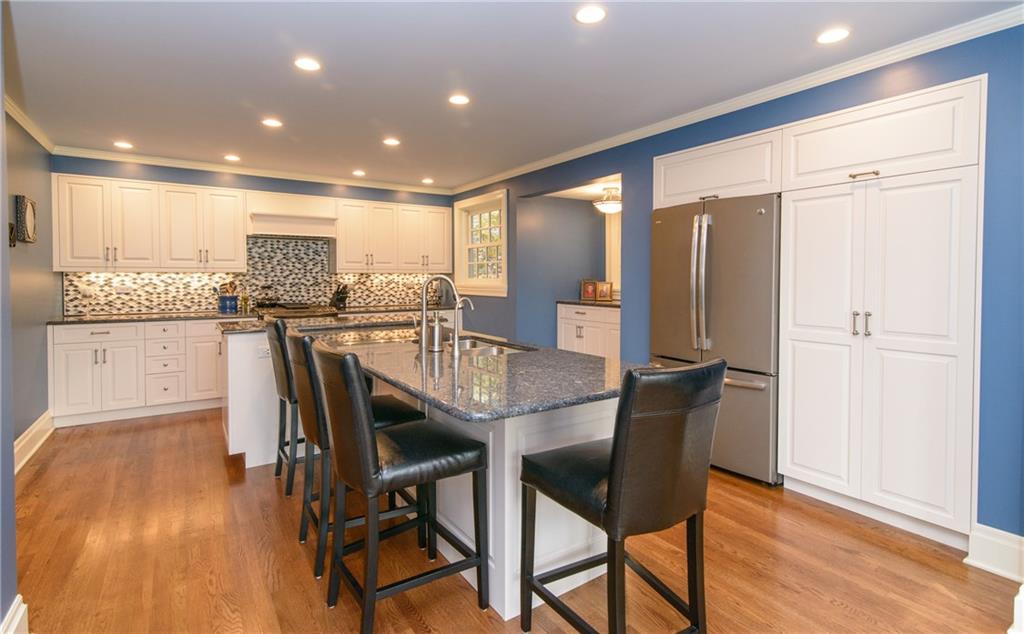 268 Merriman Road Sewickley Heights, PA 15143 - Photo 11 of 25 Another shot of the Kitchen. The sink is in the island. Pantry beside the refrigerator. Indirect lighting.