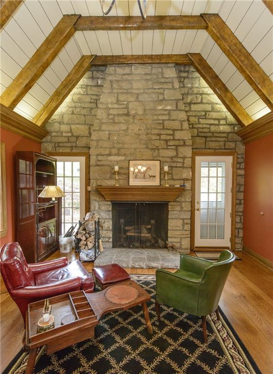 268 Merriman Road Sewickley Heights, PA 15143 - Photo 14 of 25 This is the other end of the great room showing the beautiful stone log burning fireplace, the soaring ceiling and the French door on the right goes out to the dog kennel and the Spring House.