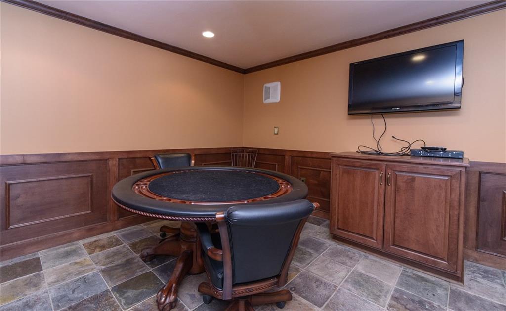 268 Merriman Road Sewickley Heights, PA 15143 - Photo 24 of 25 The game room has a TV, sink, Tile flooring and is directly connected to the wine room.