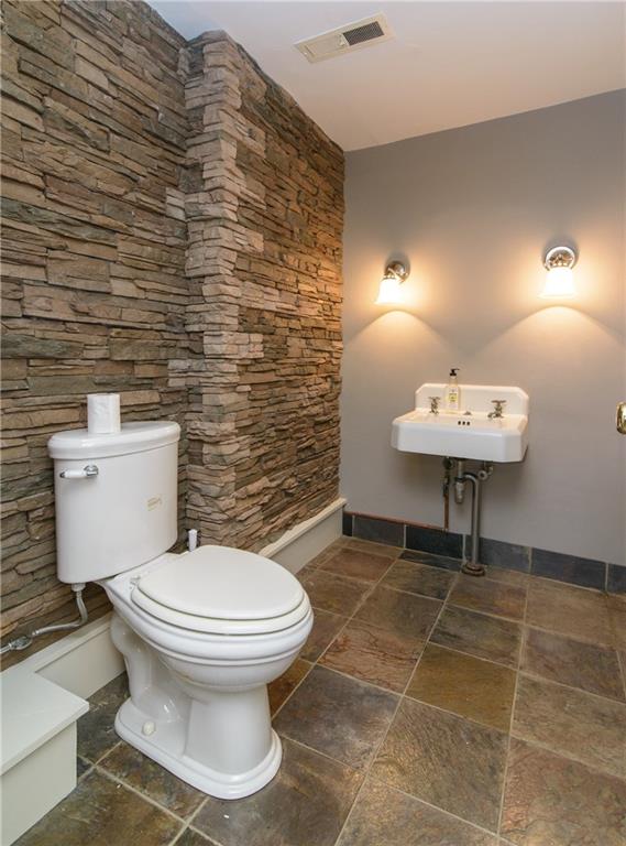 268 Merriman Road Sewickley Heights, PA 15143 - Photo 25 of 25 One of the 3 powder rooms. This one is next to the game room on the lower level. Stone wall and ceramic tile flooring.