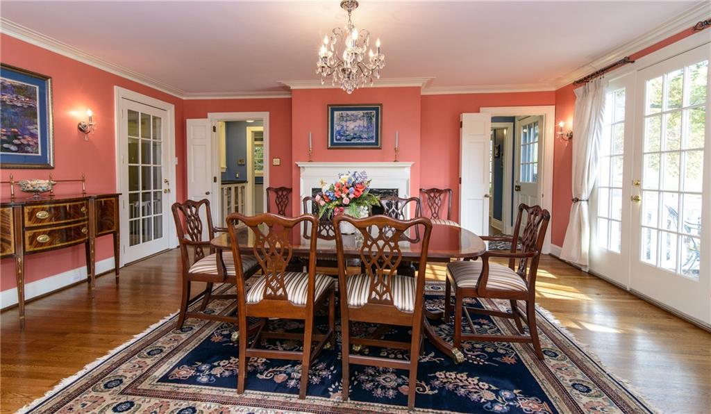 268 Merriman Road Sewickley Heights, PA 15143 - Photo 9 of 25 The Formal Dining Room has arched built ins, a fireplace and French doors which lead out to the property. The view is the pond and rolling hillside.