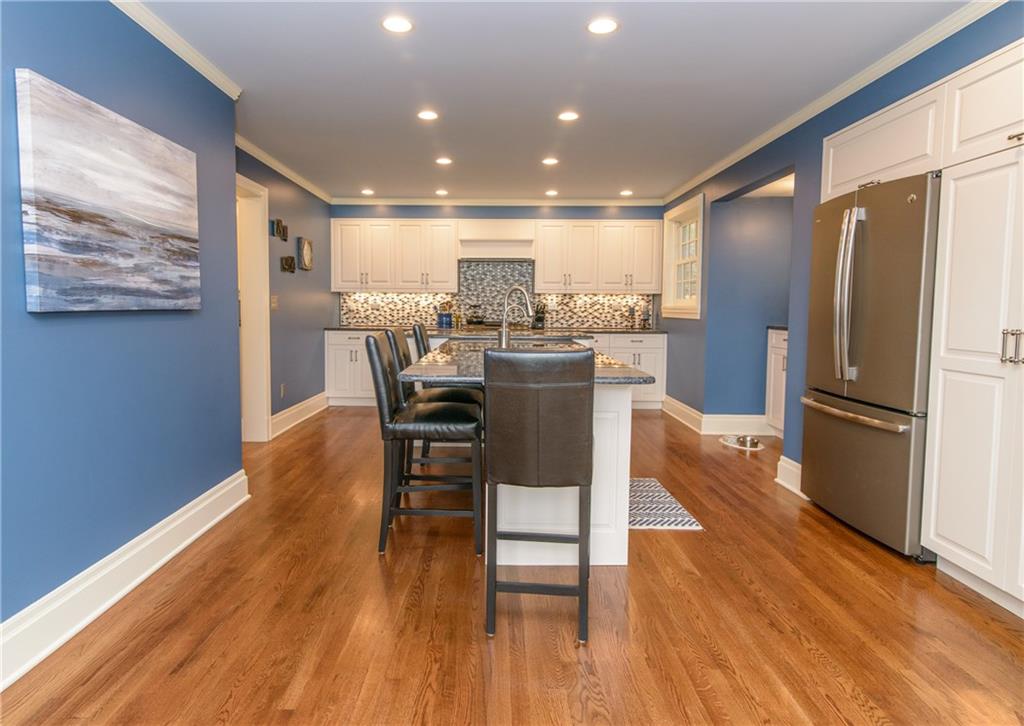 268 Merriman Road Sewickley Heights, PA 15143 - Photo 10 of 25 The kitchen is totally new, floors,Stainless appliances, gas stove, pantry with pull out shelves, granite counters and beautiful tile back splash. At the opposite end is a bay window and room for a table, overlooking the pond.