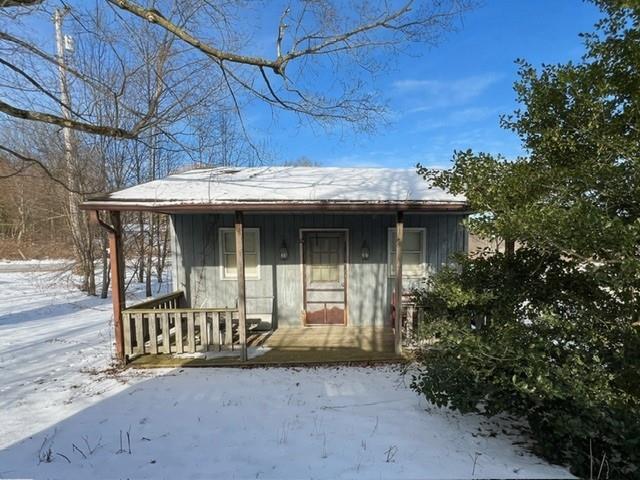 2029 Perry Highway Volant, PA 16156 - Photo 4 of 30 a view of a house with a porch and furniture