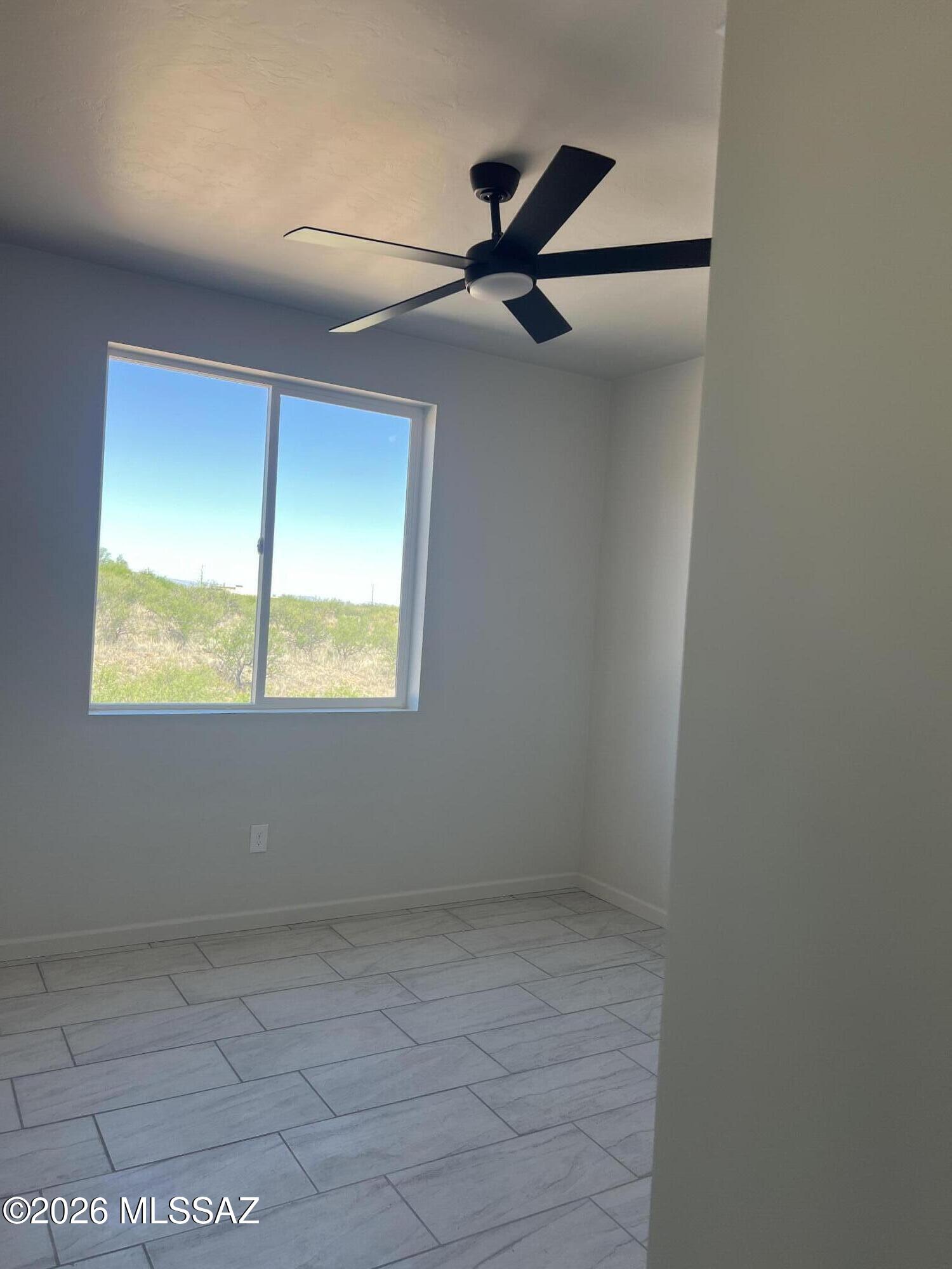 1501 Circulo Sombrero Rio Rico, AZ 85648 - Photo 13 of 26 an empty room with windows