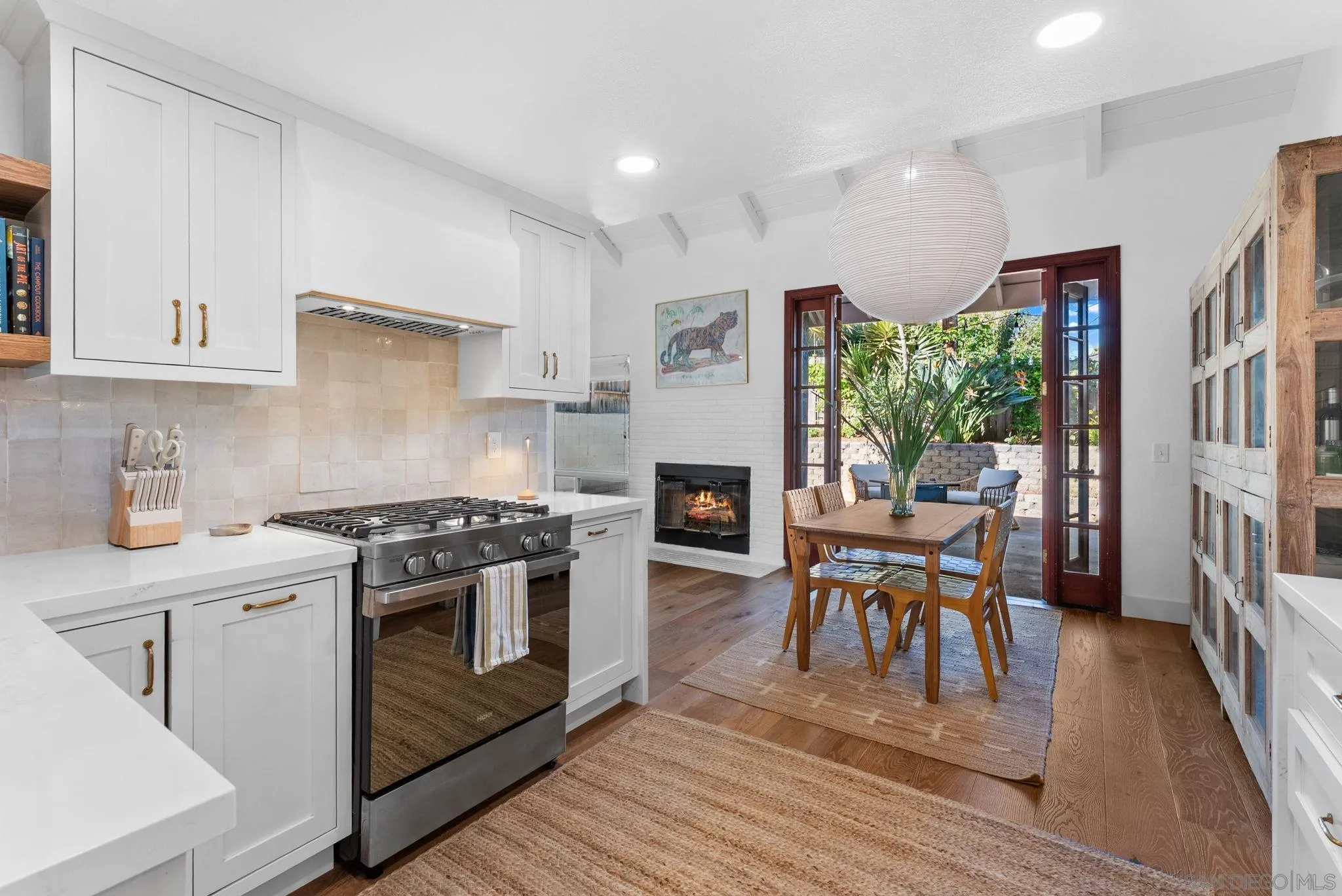 144 Coop Court Encinitas, CA 92024 - Photo 11 of 28 a kitchen with stainless steel appliances granite countertop a stove top oven a sink dishwasher and a refrigerator with wooden floor
