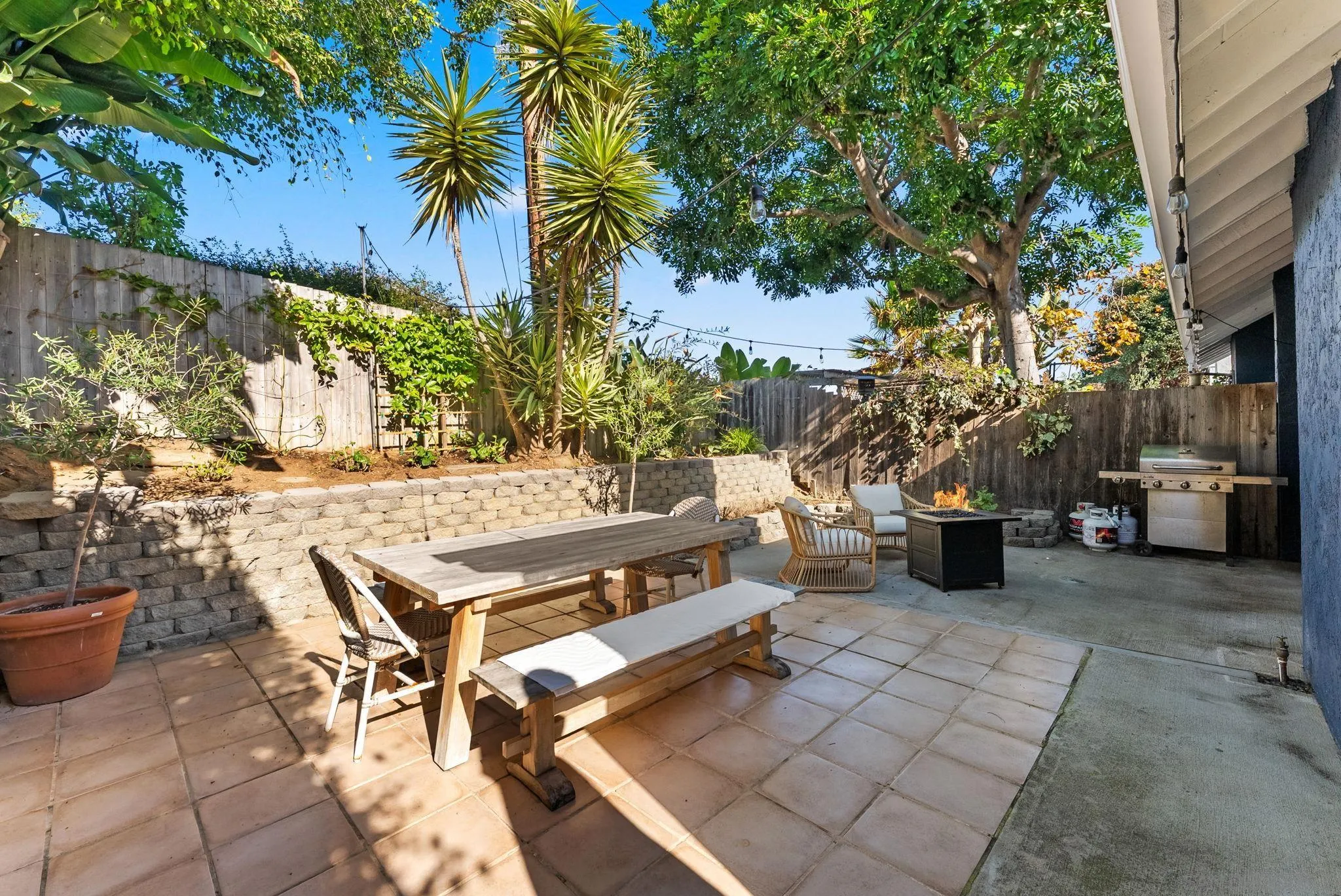 144 Coop Court Encinitas, CA 92024 - Photo 24 of 28 a view of a patio with a table and chairs