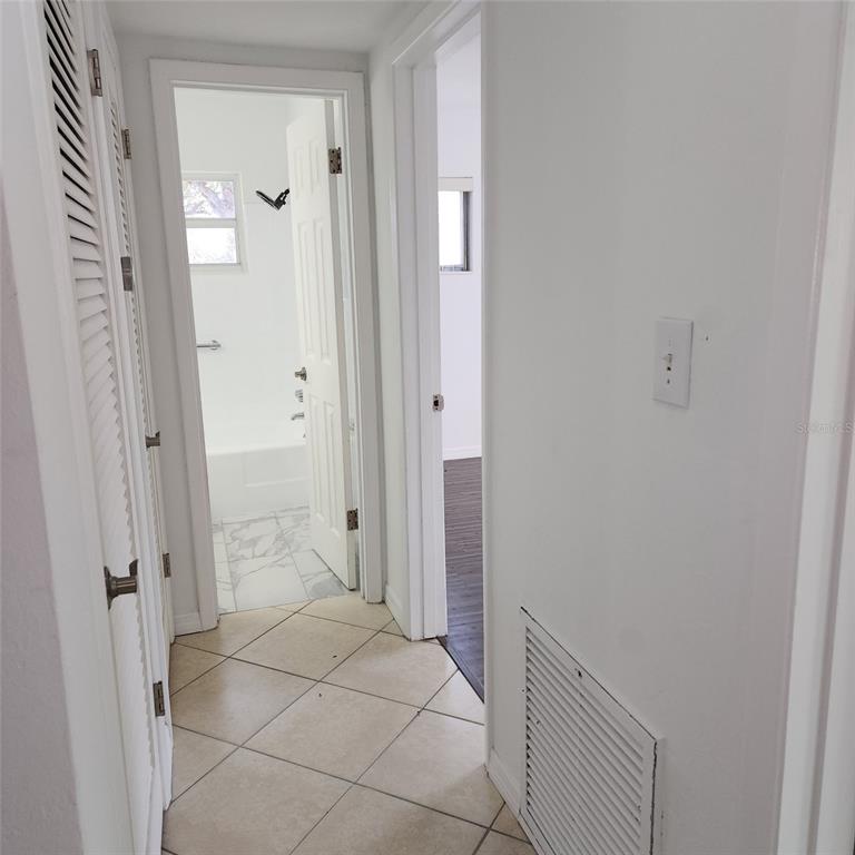 3925 Omega Lane Sarasota, FL 34235 - Photo 15 of 22 a view of a bathroom from the hallway