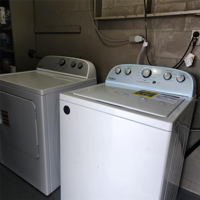 3925 Omega Lane Sarasota, FL 34235 - Photo 20 of 22 a utility room with dryer and washer