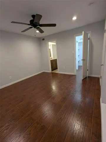 a view of walk in closet with wooden floor