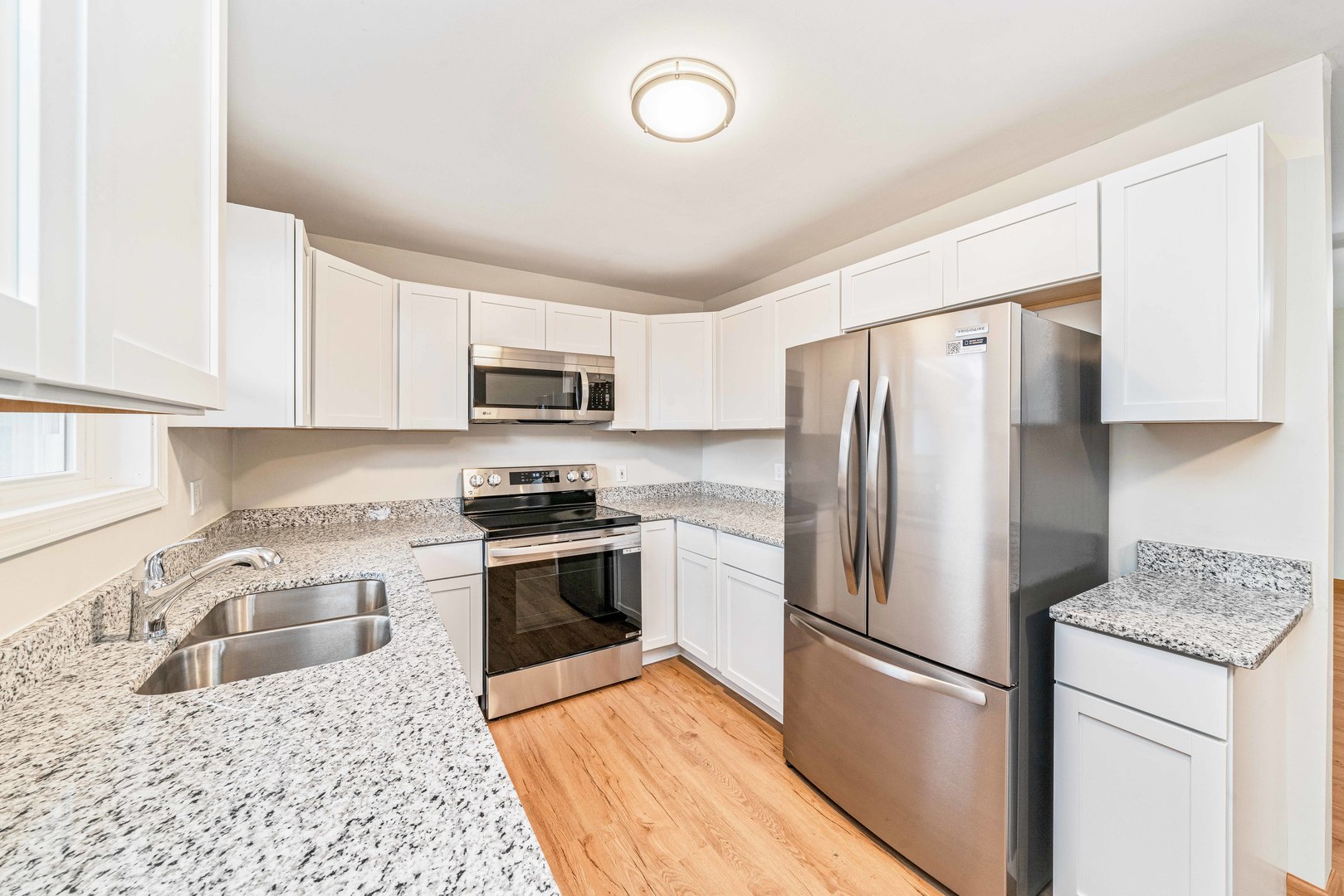1839 Irene Road Lake Holiday, IL 60548 - Photo 4 of 19 a kitchen with granite countertop stainless steel appliances a refrigerator a stove top oven a sink and dishwasher