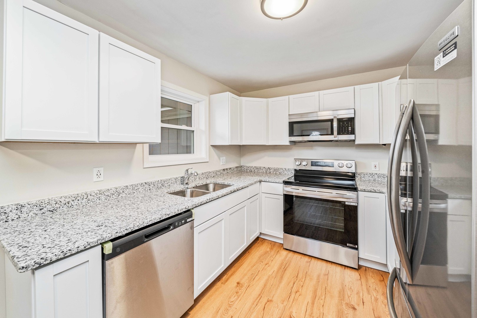 1839 Irene Road Lake Holiday, IL 60548 - Photo 5 of 19 a kitchen with a sink stove and microwave
