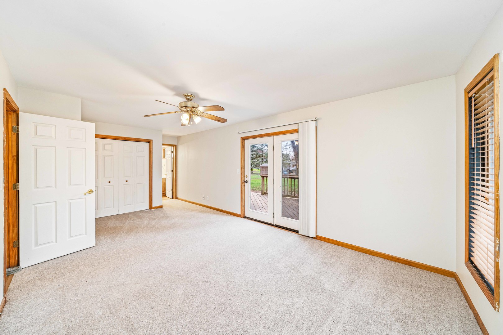 1839 Irene Road Lake Holiday, IL 60548 - Photo 8 of 19 an empty room with a chandelier fan and windows