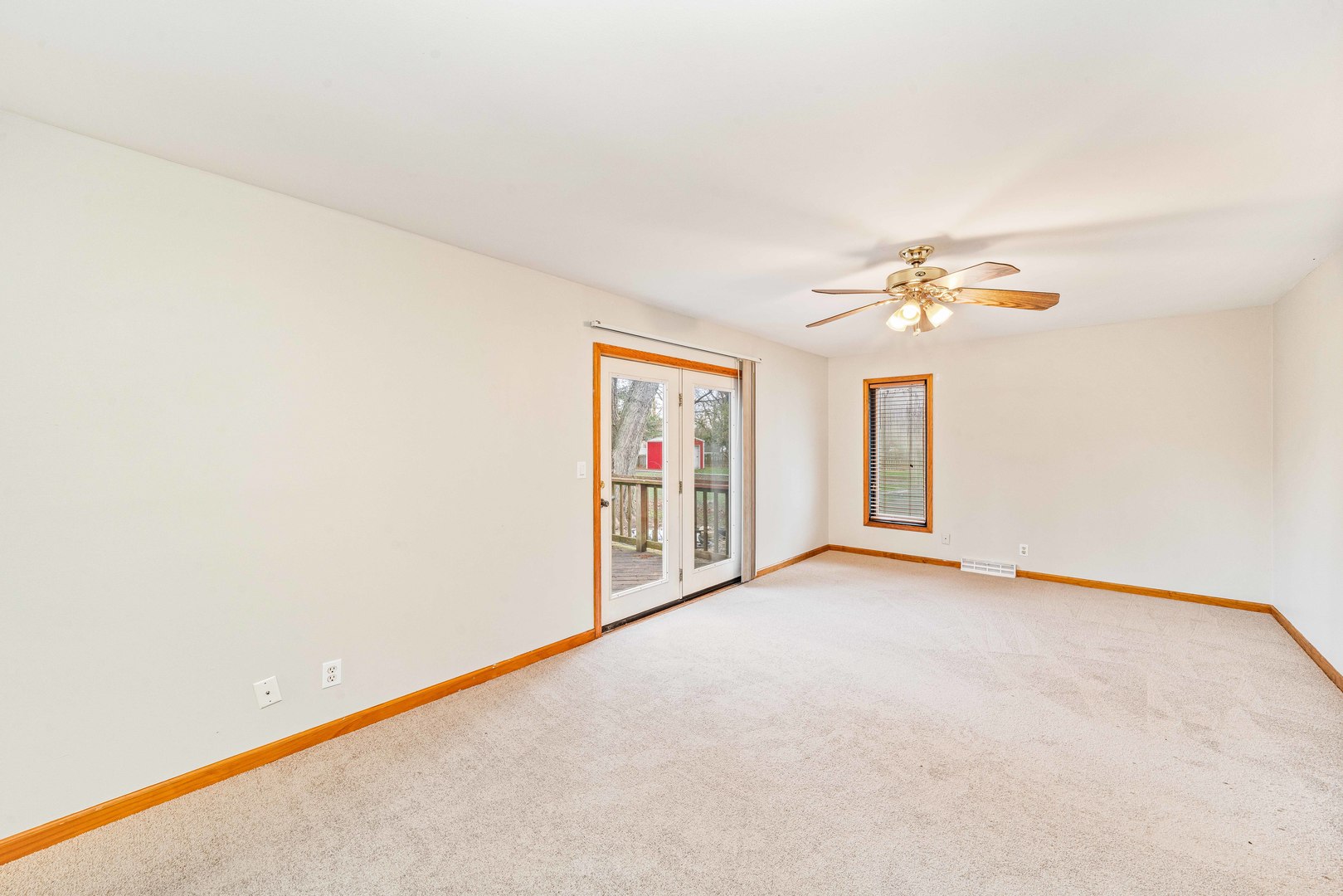 1839 Irene Road Lake Holiday, IL 60548 - Photo 9 of 19 an empty room with chandelier fan and windows
