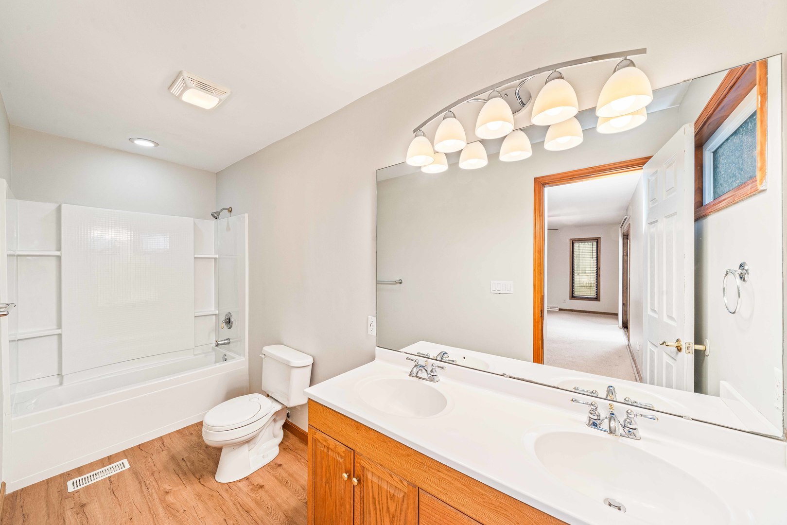 1839 Irene Road Lake Holiday, IL 60548 - Photo 10 of 19 a bathroom with a sink a toilet and shower