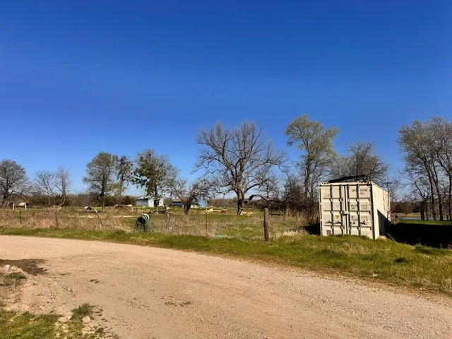 a view of a backyard of the house