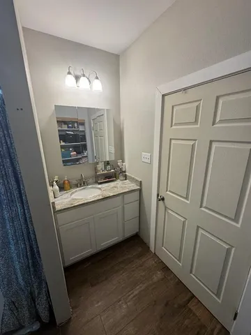 a room with a bed and a mirror