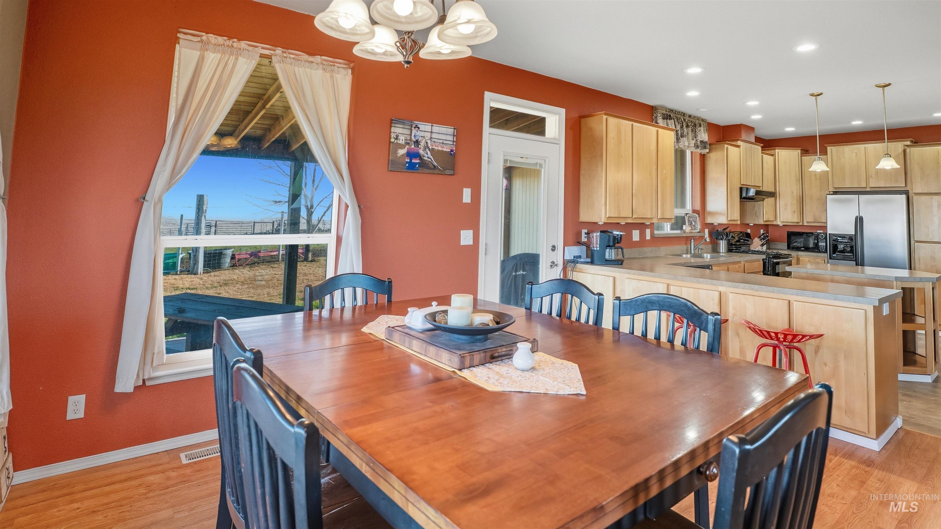 19397 Cloverland Road Asotin, WA 99402 - Photo 8 of 37 Dining space with suspended lighting and light wood-type flooring