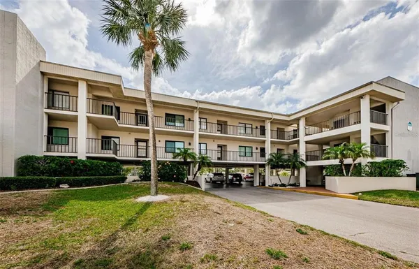 a front view of building with yard