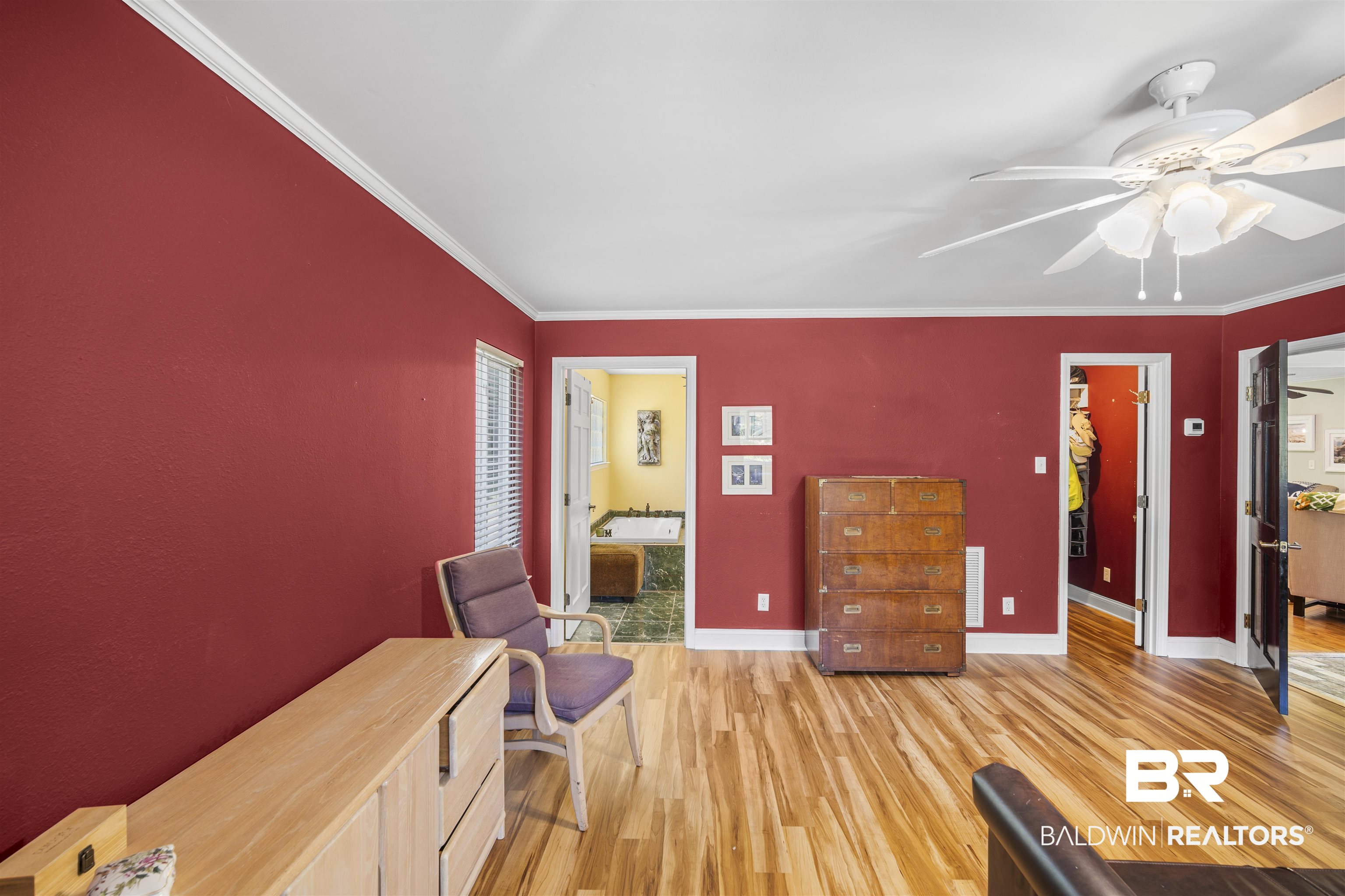 1615 5th Street Daphne, AL 36526 - Photo 14 of 28 Interior space featuring wood-finish flooring, white crown molding, and a ceiling fan with integrated lighting