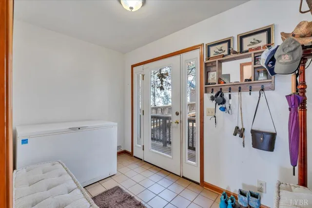 a bathroom with a tub a sink and a large mirror