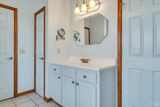 a living room with furniture and a dining table with wooden floor