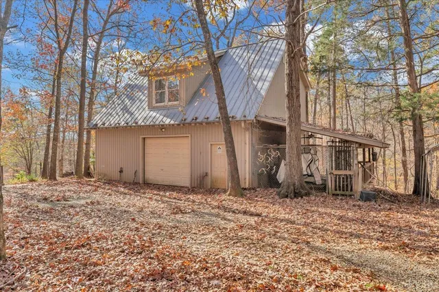 a view of a yard with a tree