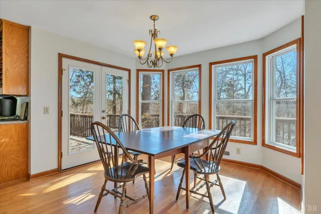 a kitchen with stainless steel appliances granite countertop wooden cabinets microwave and stove top oven