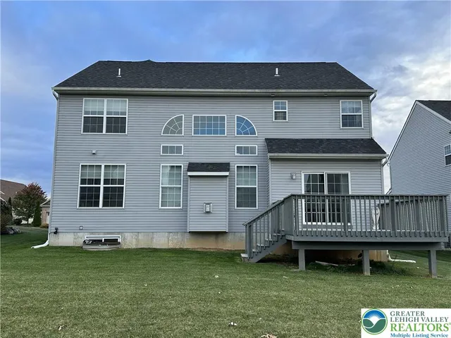 a kitchen with stainless steel appliances a stove refrigerator and microwave