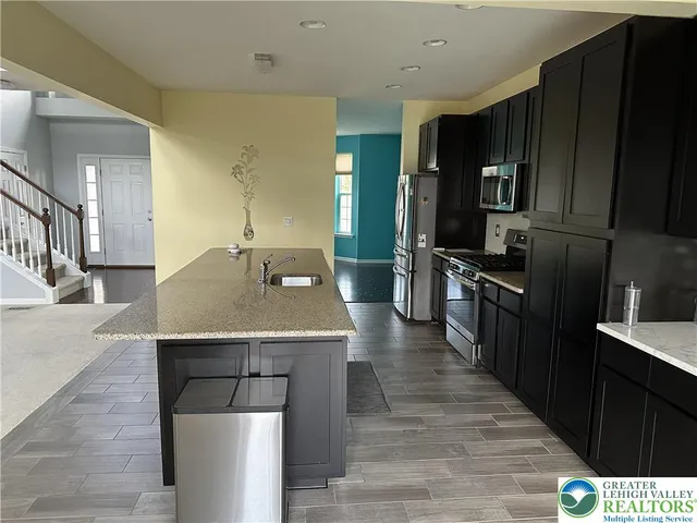 a kitchen with a stove and a microwave