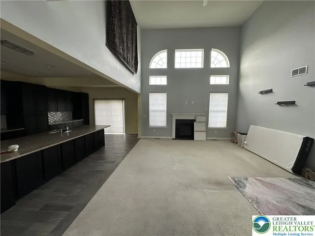 a large living room with a large window