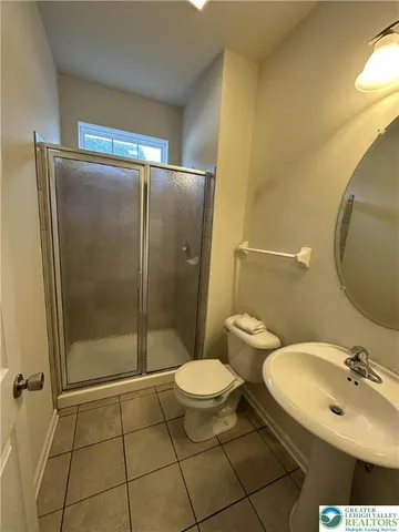 a bathroom with a toilet and a sink