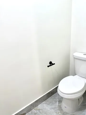 a bathroom with a sink double vanity and a mirror