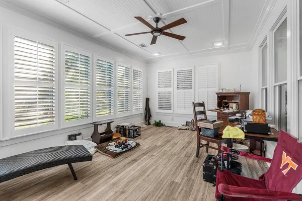 a bedroom with a large bed and a flat tv screen