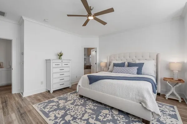 a bathroom with a tub a sink and a window