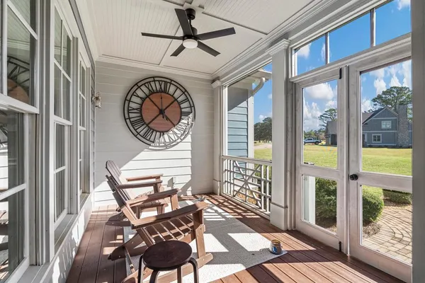 a view of a chairs and table in a balcony