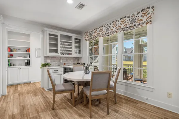 a view of a dining room with furniture and window