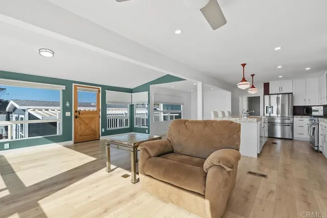 a bed room with a bed and a ceiling fan