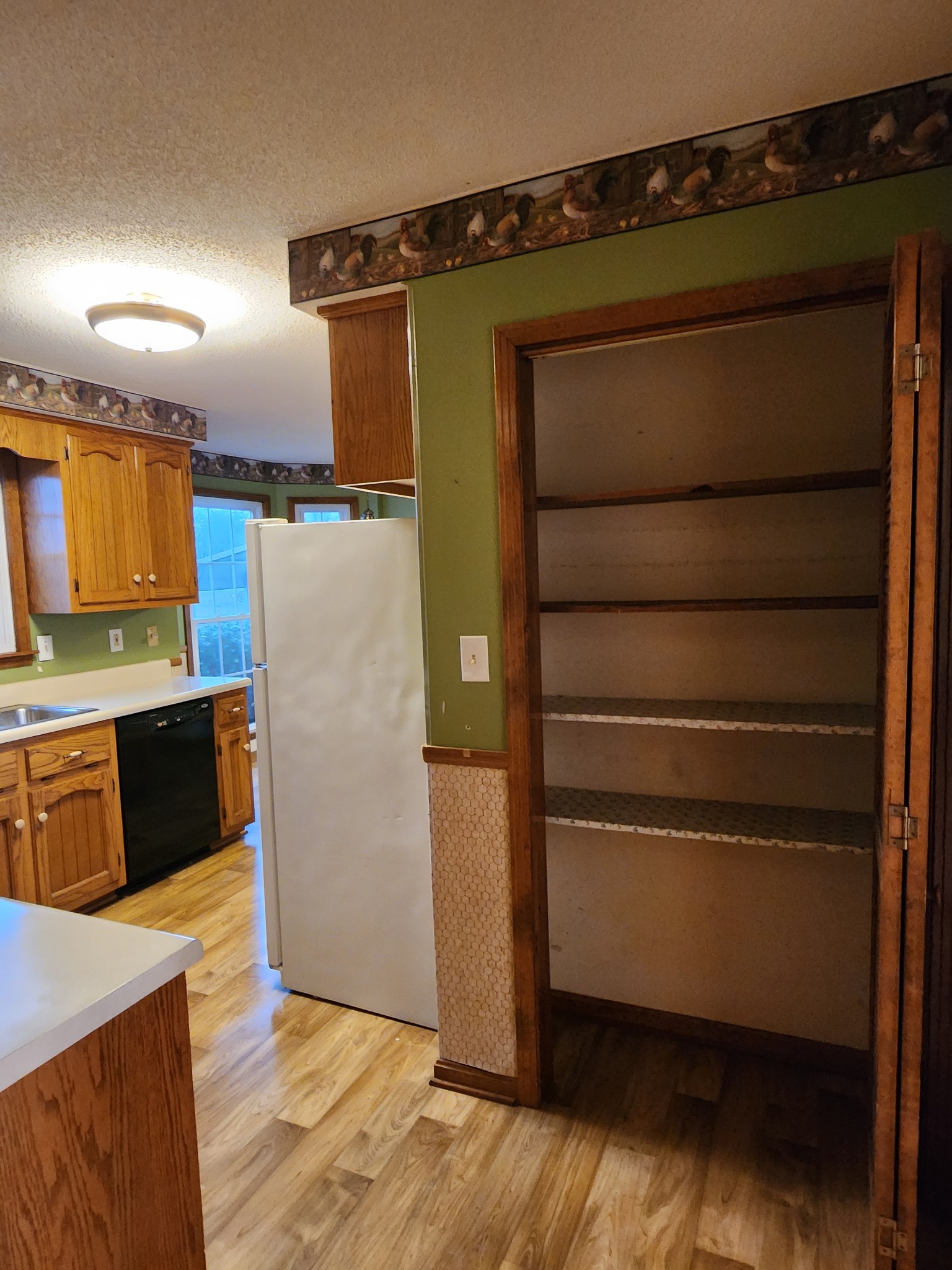 819 Branch Bend Road Clarksville, TN 37040 - Photo 11 of 24 a kitchen with a refrigerator and cabinets