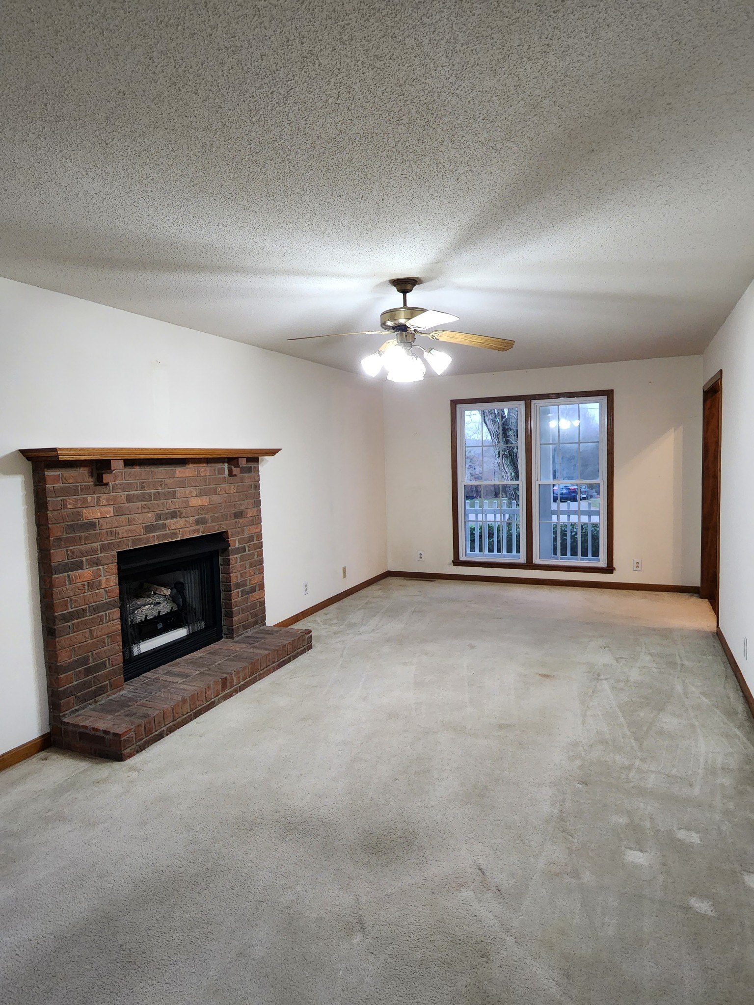 819 Branch Bend Road Clarksville, TN 37040 - Photo 13 of 24 a view of an empty room with a fireplace