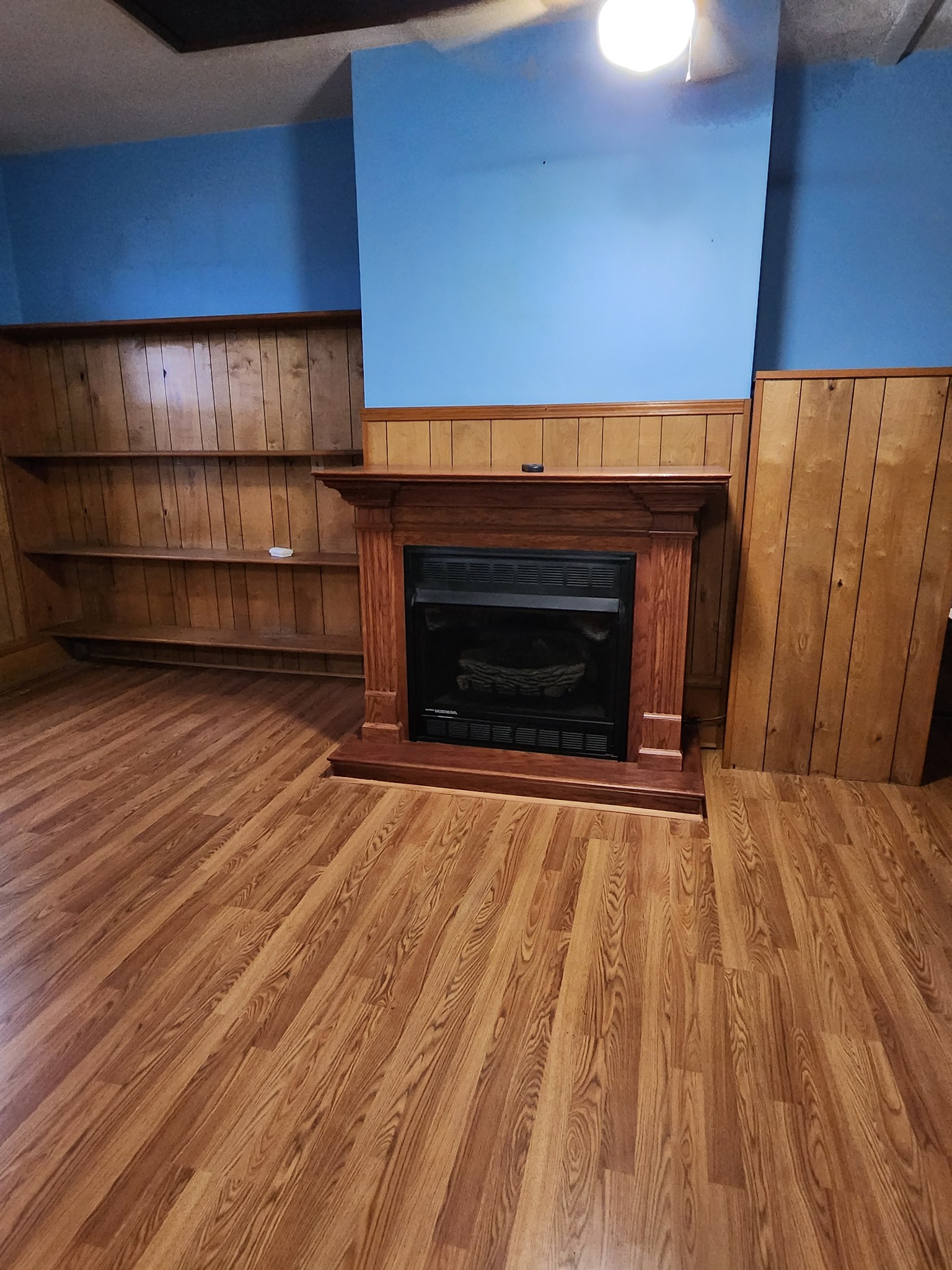 819 Branch Bend Road Clarksville, TN 37040 - Photo 19 of 24 a living room with a fireplace furniture and a wooden floor