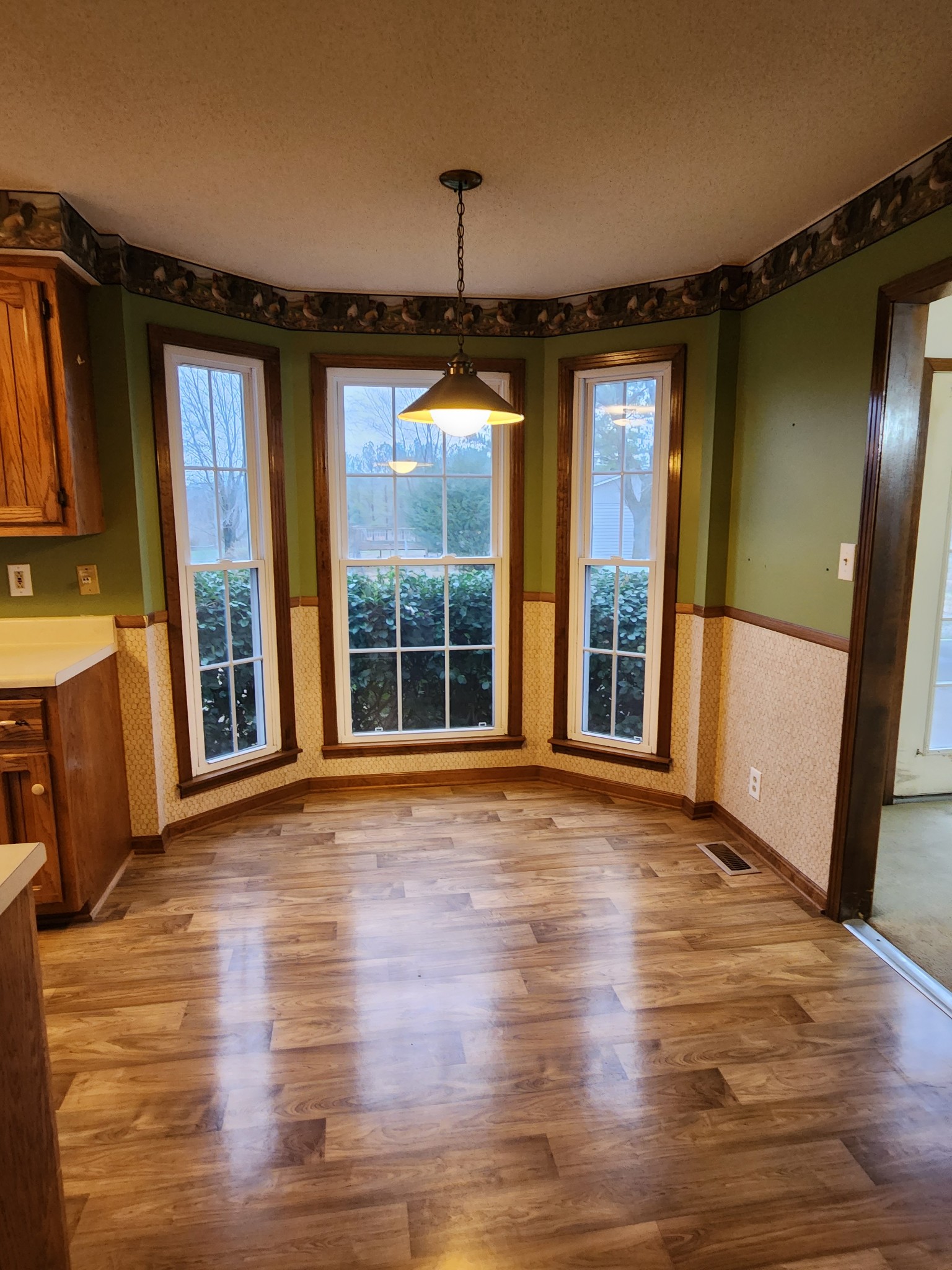 819 Branch Bend Road Clarksville, TN 37040 - Photo 10 of 24 a view of an empty room with wooden floor and a window