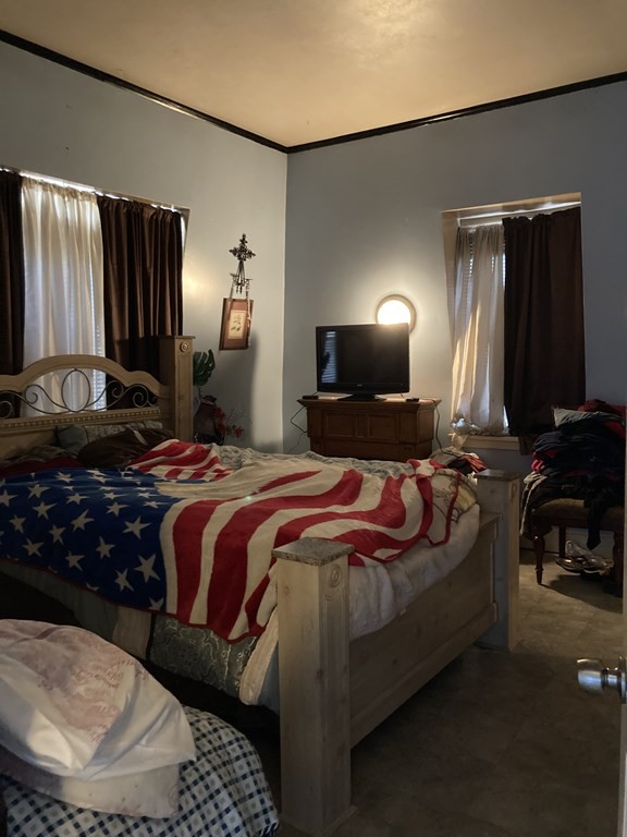 662 Main Street Haverhill, MA 01830 - Photo 12 of 23 a bedroom with a bed and lamp