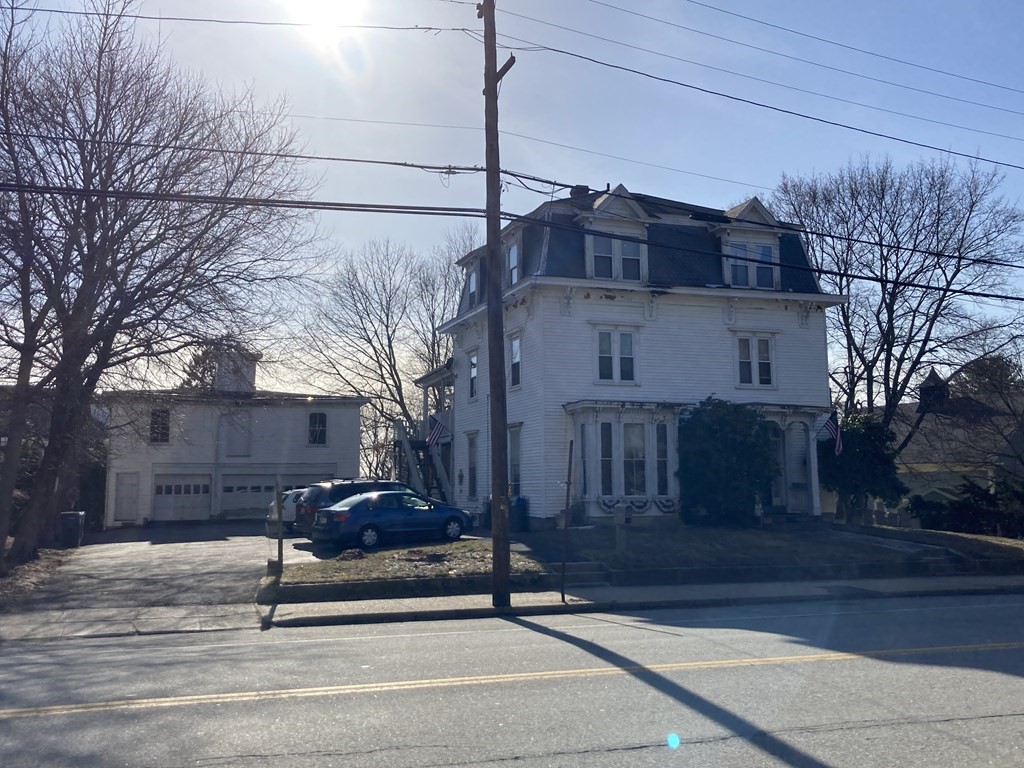 662 Main Street Haverhill, MA 01830 - Photo 2 of 23 a bench sitting in front of a house