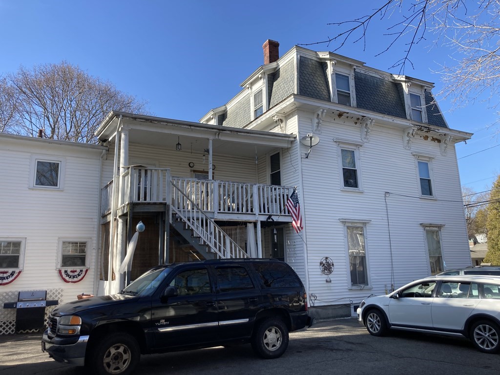 662 Main Street Haverhill, MA 01830 - Photo 8 of 23 a car parked in front of a house