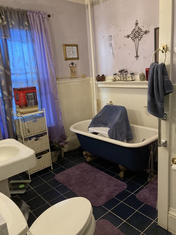 662 Main Street Haverhill, MA 01830 - Photo 10 of 23 a living room with a rug and a table