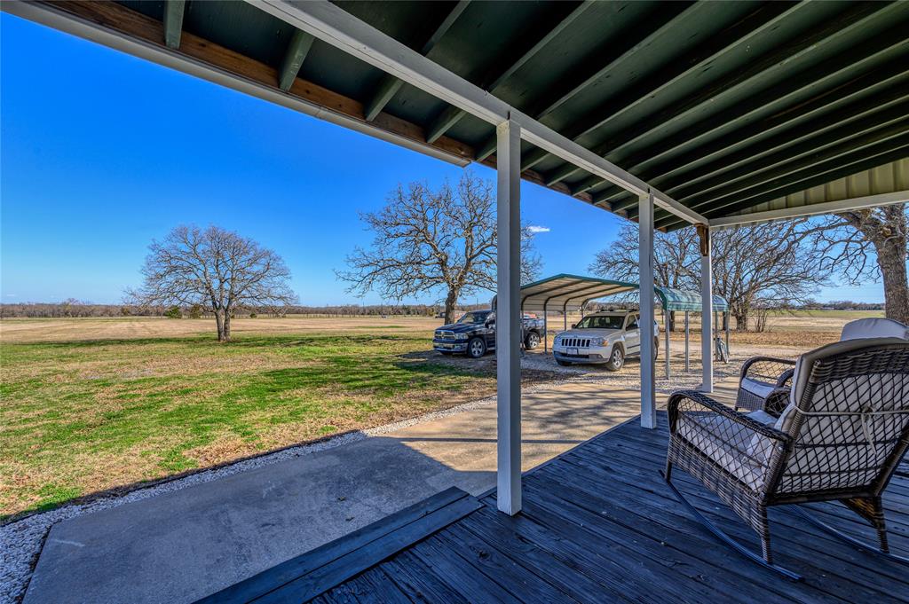 4597 West Line Road Whitesboro, TX 76273 - Photo 11 of 31 a view of a couches in patio of a house