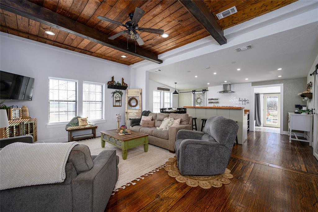 4597 West Line Road Whitesboro, TX 76273 - Photo 15 of 31 a living room with furniture and a flat screen tv